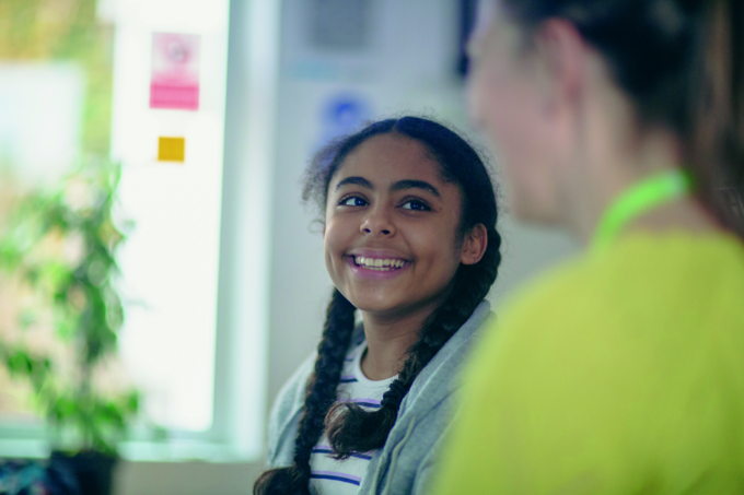 girl smiling with worker